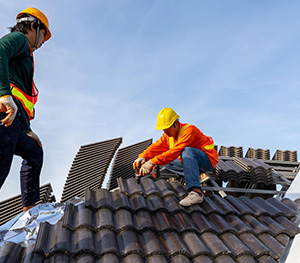 2-construction-workers-install-new-roof-construction-site-electric-drill-used-new-roofs-with-concrete-roof-tiles-concept-residential-building-construction-1 2-construction-workers-install-new-roof-construction-site-electric-drill-used-new-roofs-with-concrete-roof-tiles-concept-residential-building-construction-1